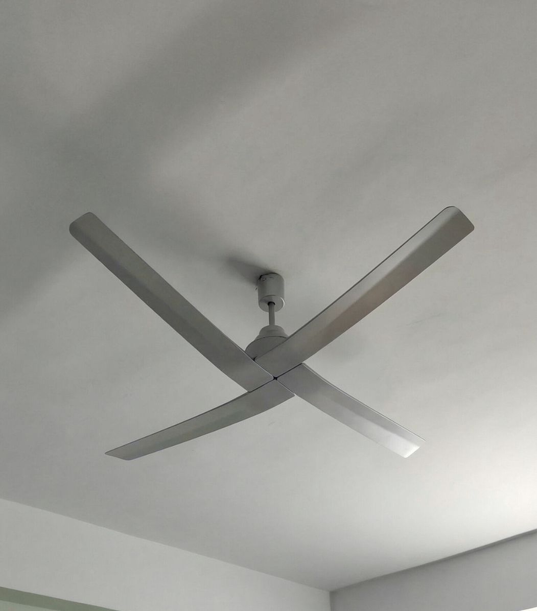 Close view of Havells Amaya 1400Mm Ceiling Fan with three sleek blades, highlighting its modern design